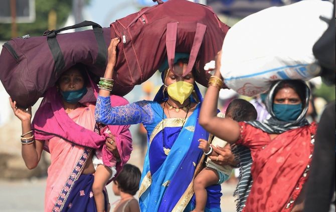  Migrants, from Uttar Pradesh, arrive to board a train at Central Railway station, during the ongoing nationwide COVID-19 lockdown, in Chennai,. (PTI Photo)